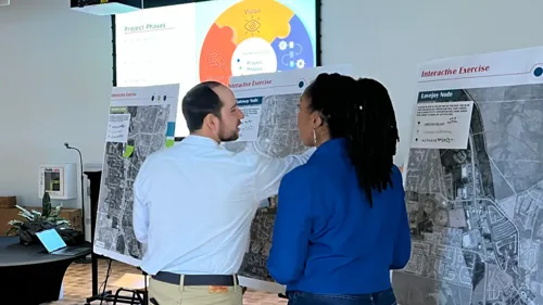 two people participating in an urban planning open house