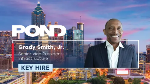 Headshot of Key Hire Grady Smith, Jr. with Atlanta, GA skyline