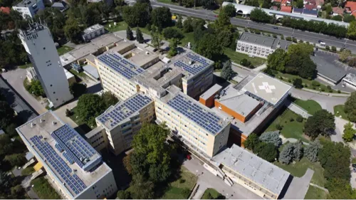 aerial view of solar panels on top of a hospital roof