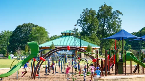 a playground with children playing on it