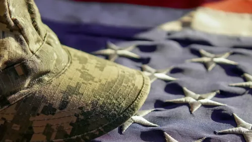 Military cap on flag