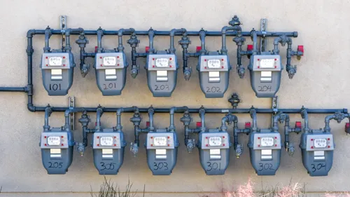 11 gas meters along a wall