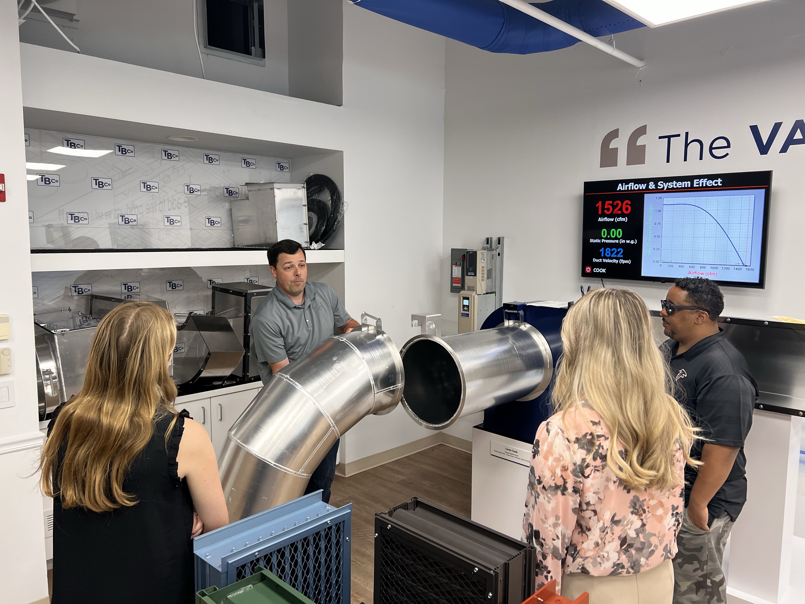 Pond interns inspecting an AC duct.