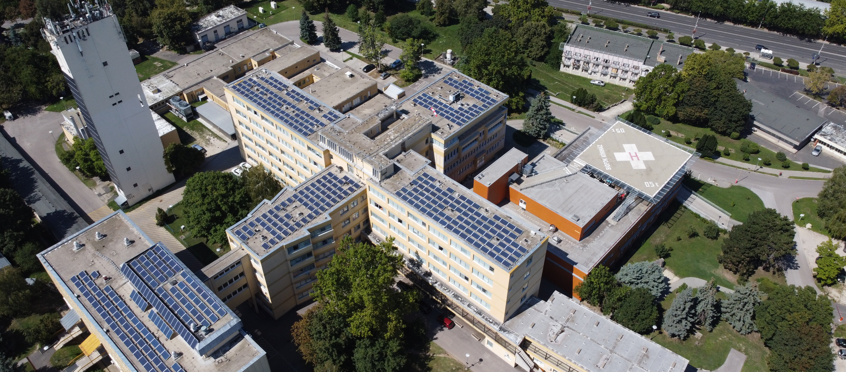 aerial view of solar panels on top of a hospital roof