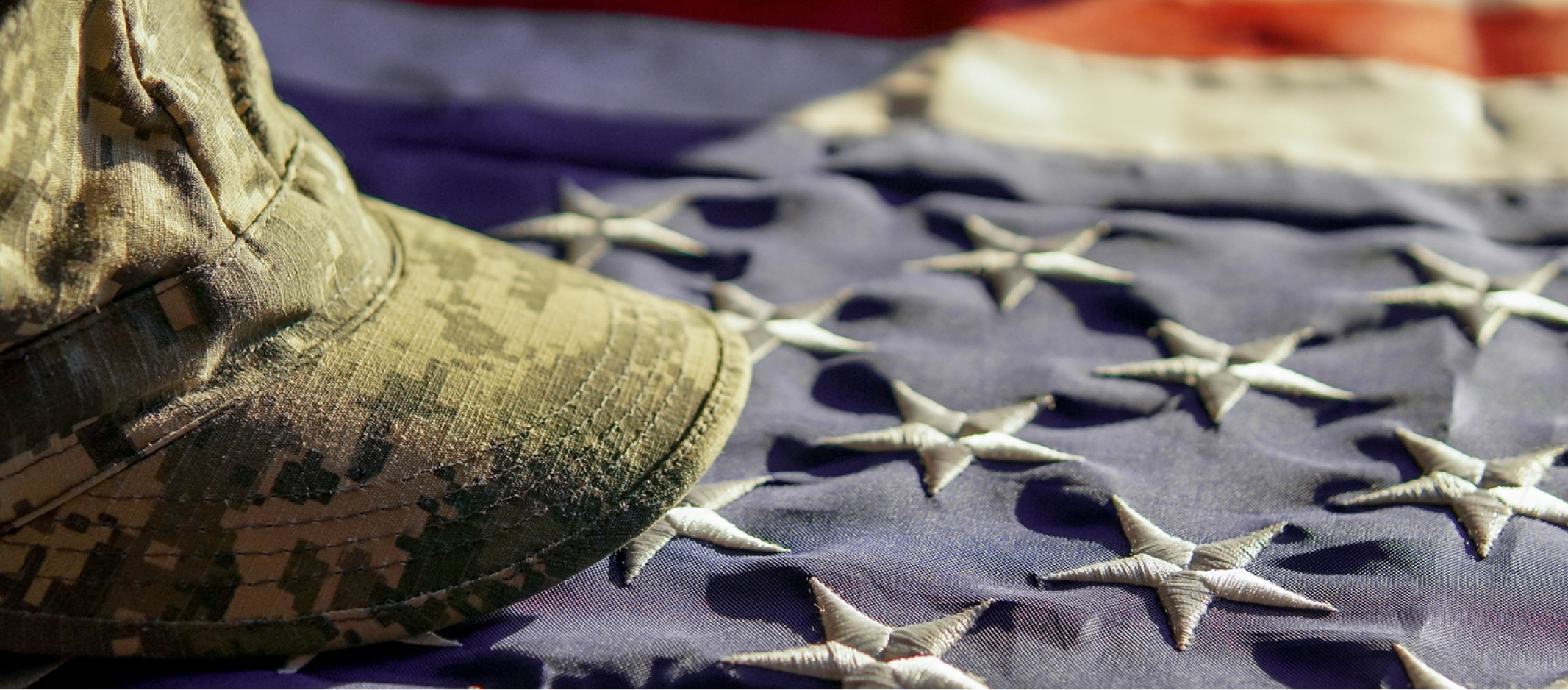 Military cap on flag.