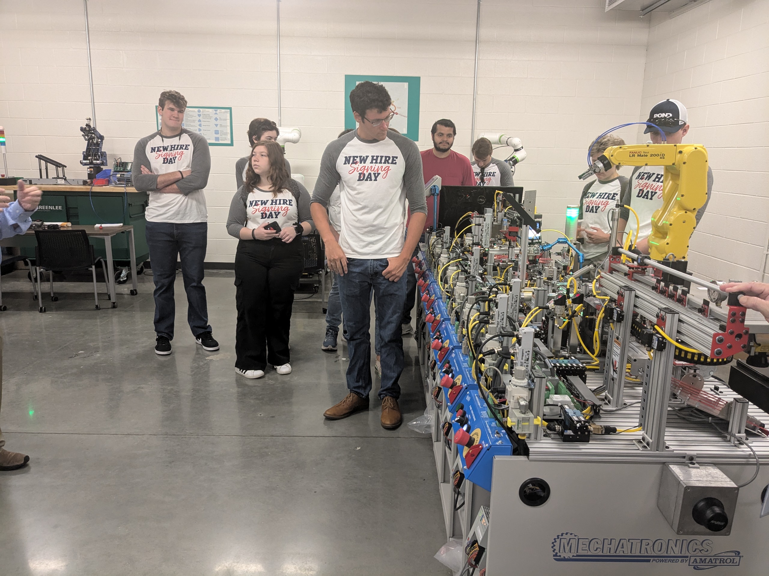 Pond interns inspecting the inner workings of a machine.